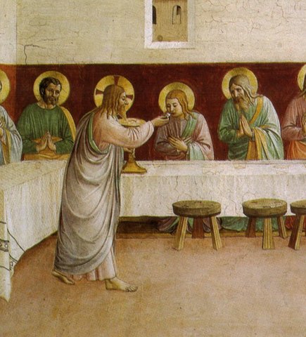 Jesus gives bread to the apostles, who kneel and sit along a long white table in a quiet room.
